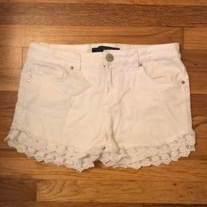 Lace trimmed white denim shorts